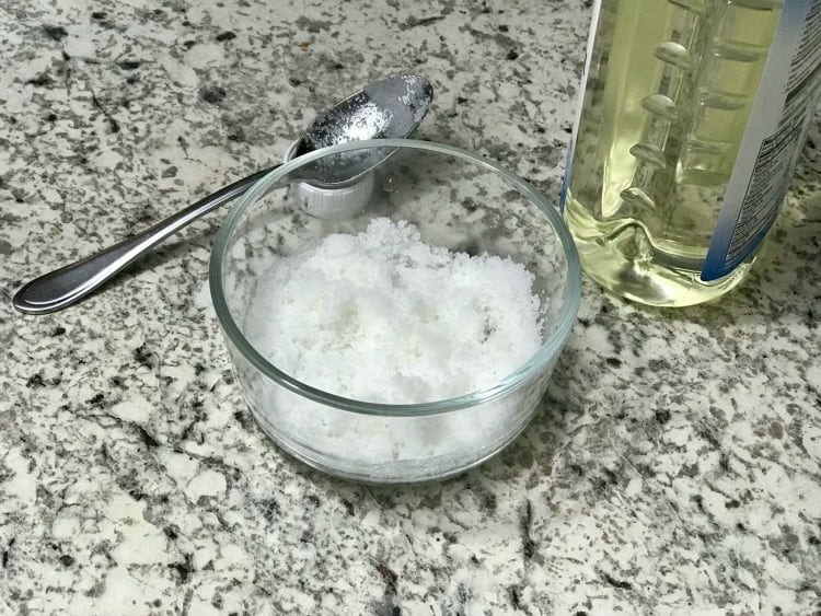 To make peppermint sugar scrub, start with mixing the oil in with the sugar. 